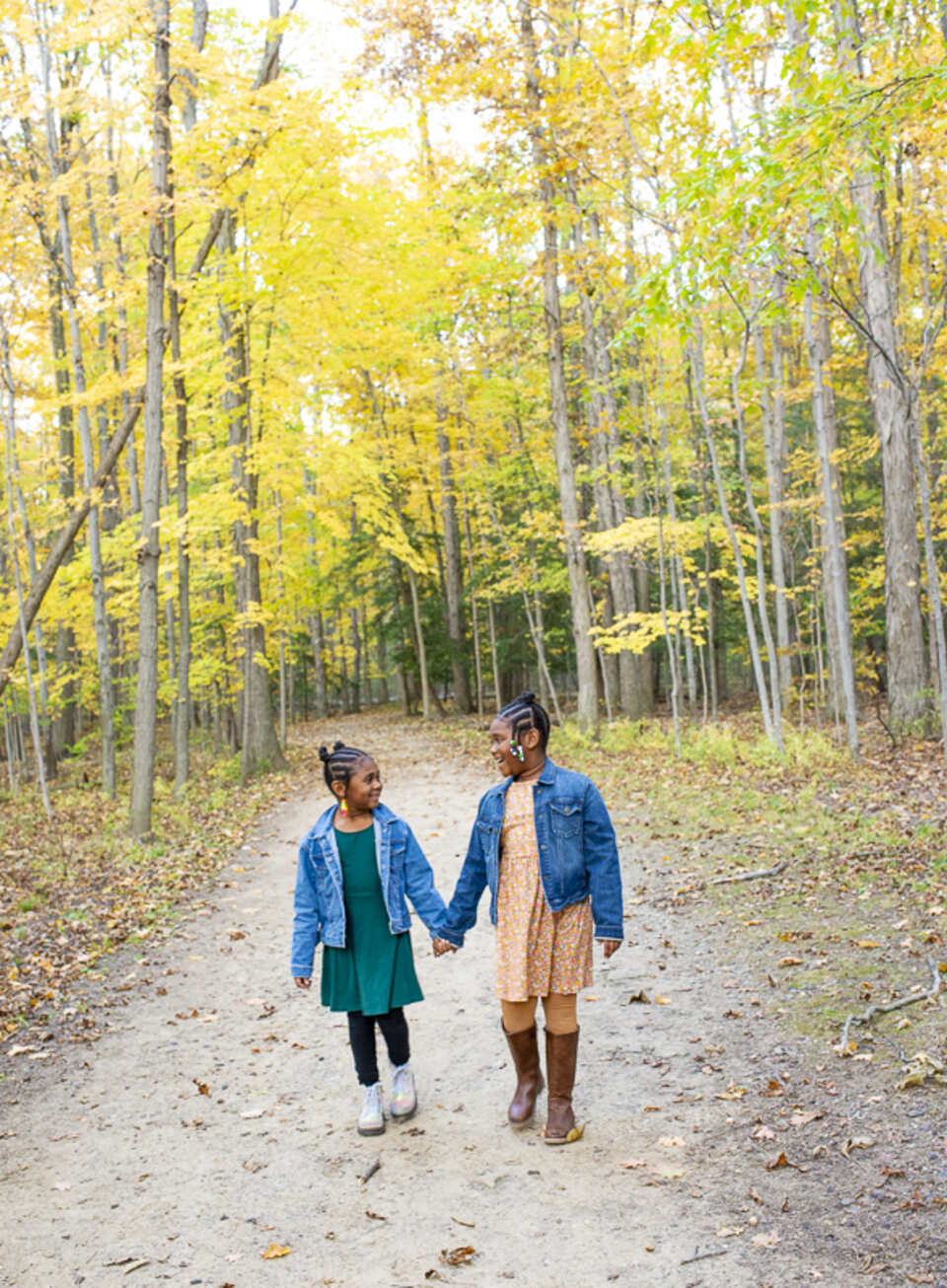 Children holding hands at the park